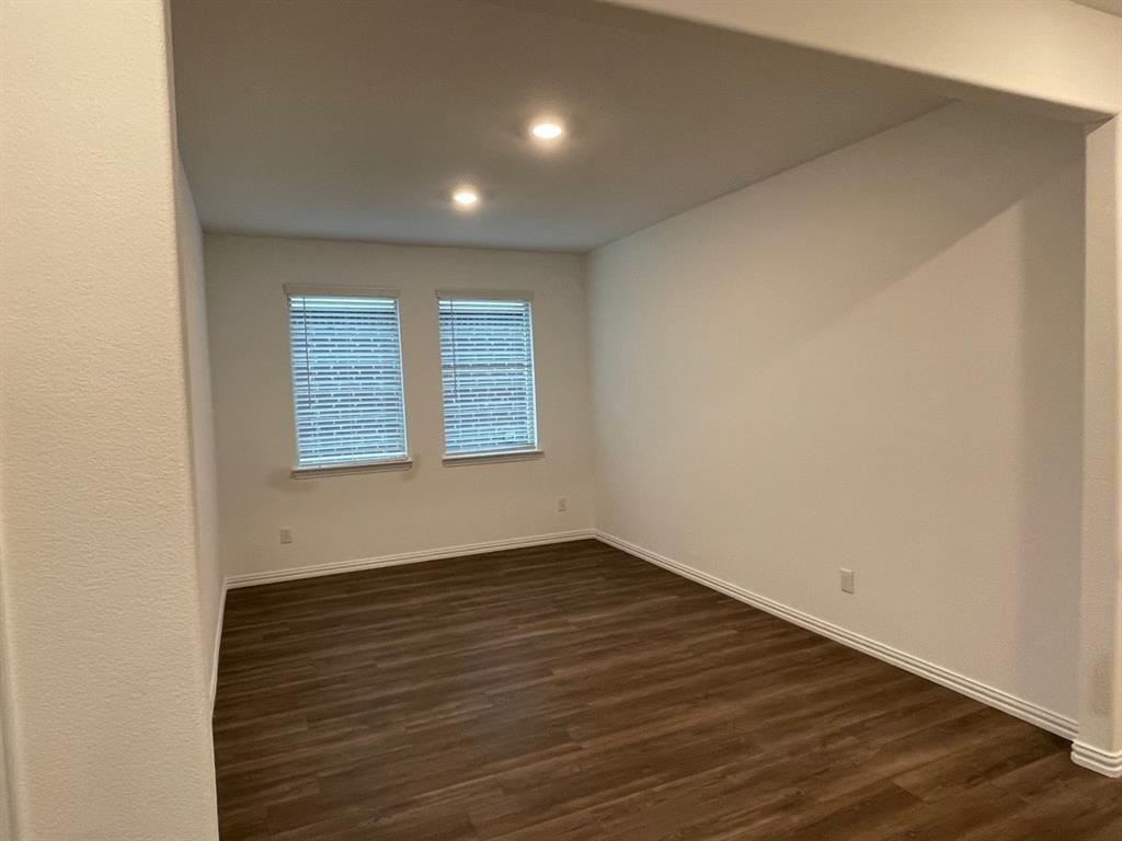 3700 Milkweed Road McKinney, TX 75071 - Photo 3 of 18 Room featuring wood-finish flooring, two windows with blinds, recessed lighting, and white baseboards