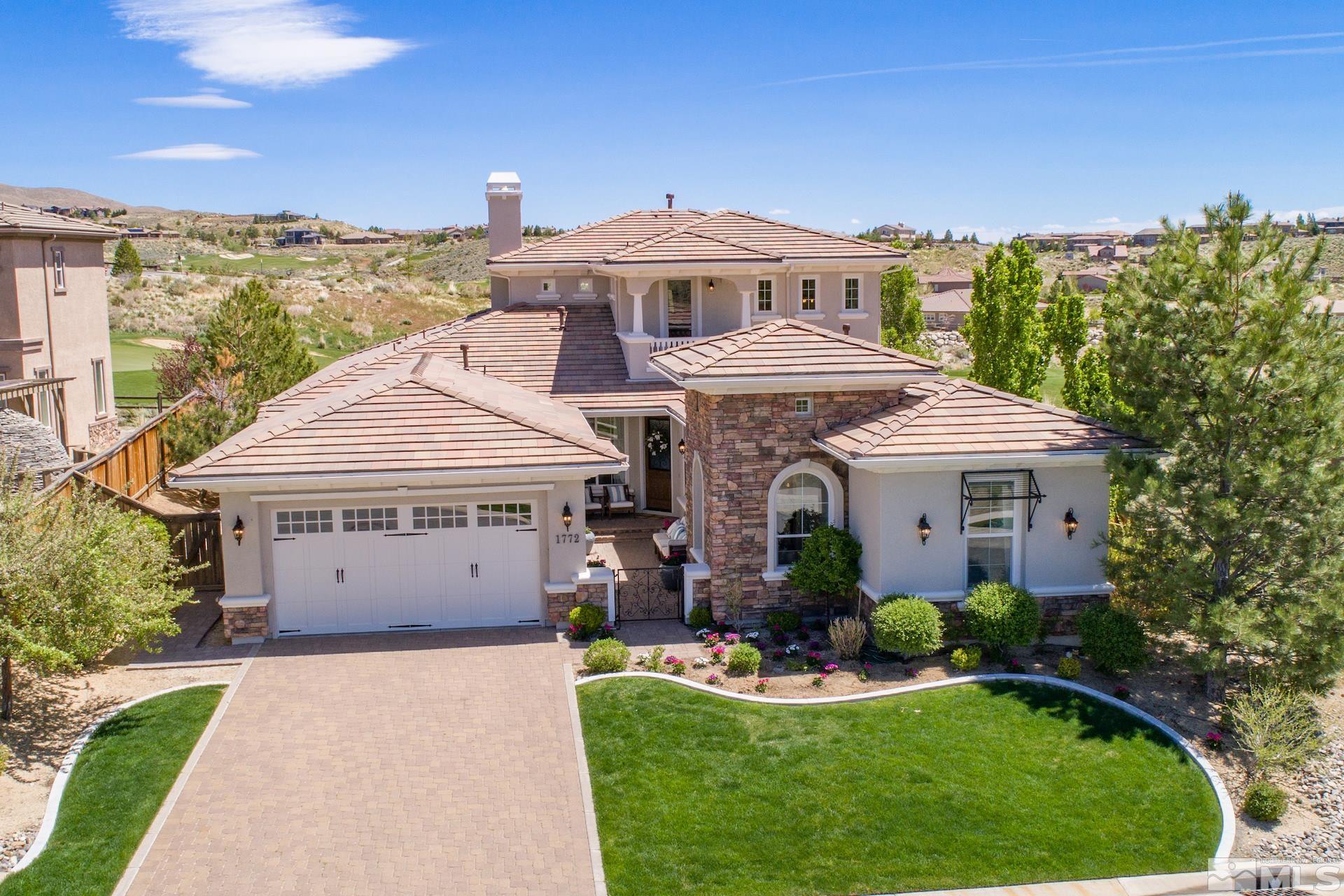 1772 Fairway Hills Trail Reno, NV 89523 - Photo 1 of 33 a front view of a house with a yard and garage