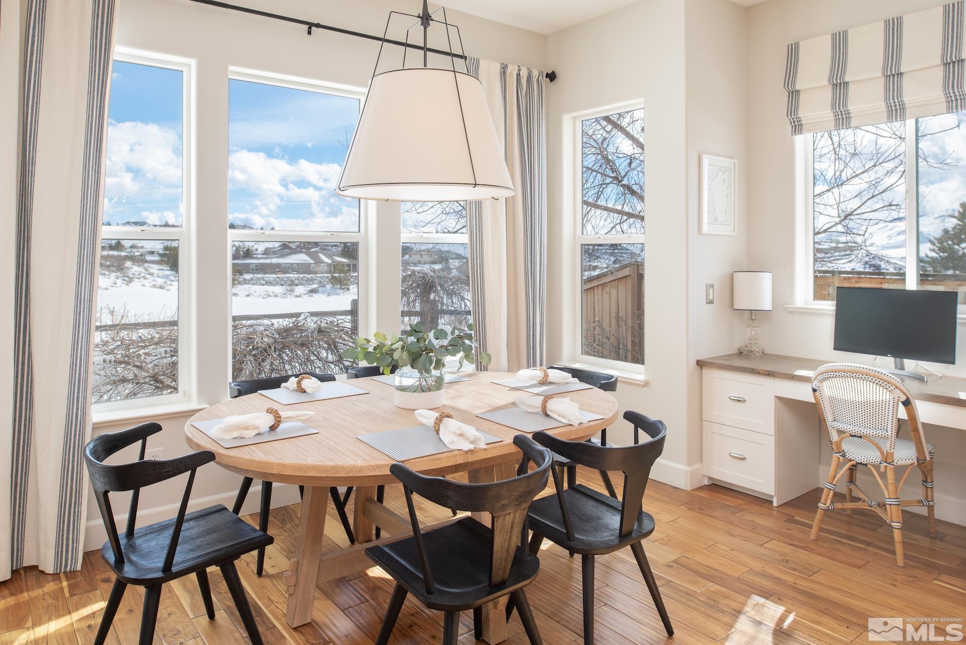 1772 Fairway Hills Trail Reno, NV 89523 - Photo 13 of 33 a view of a dining room with furniture large windows and wooden floor