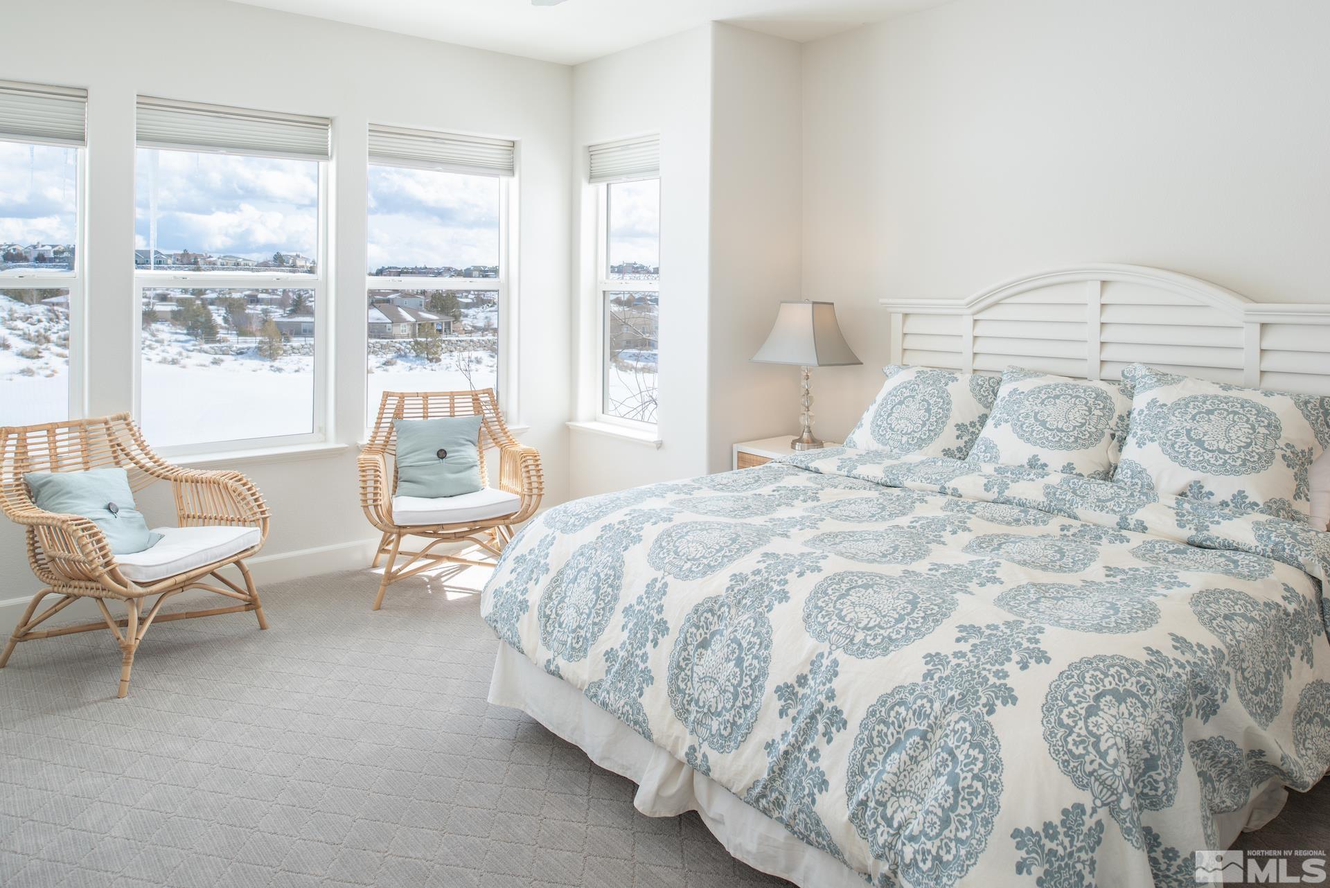 1772 Fairway Hills Trail Reno, NV 89523 - Photo 19 of 33 a bedroom with a bed chair and a large window