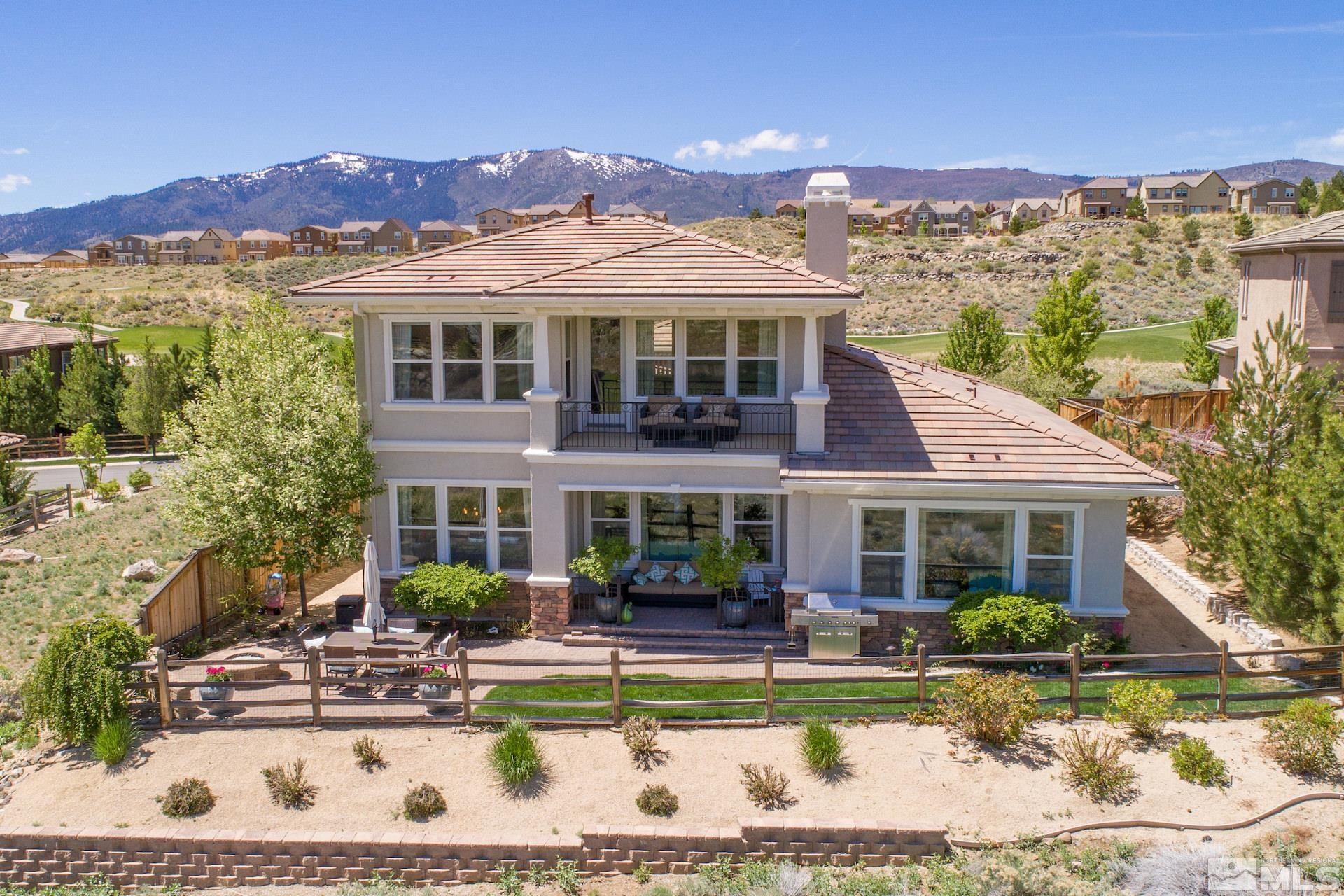 1772 Fairway Hills Trail Reno, NV 89523 - Photo 2 of 33 a front view of a house with a yard table and chairs