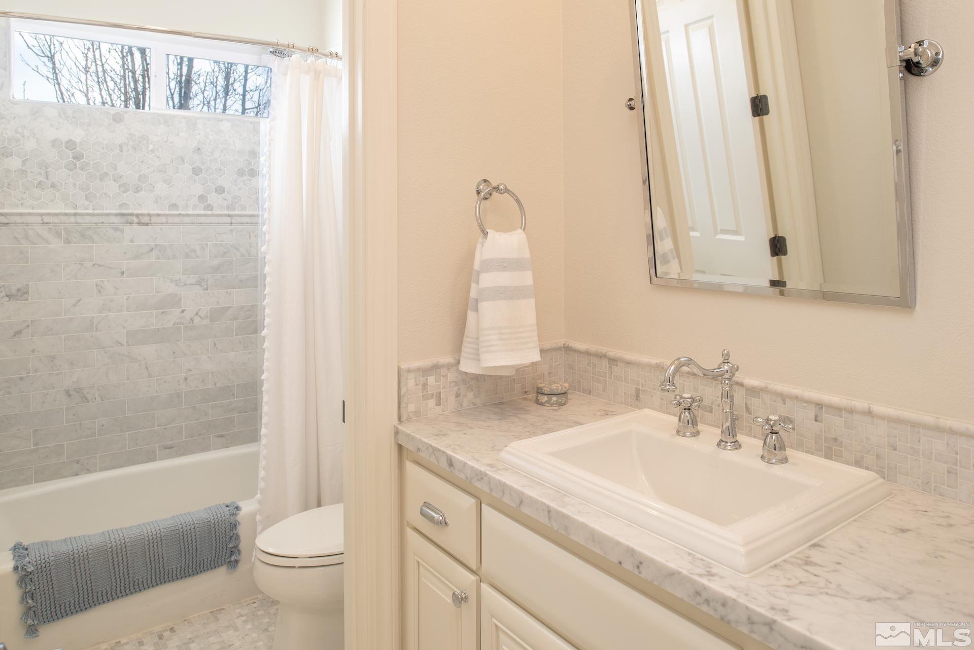 1772 Fairway Hills Trail Reno, NV 89523 - Photo 21 of 33 a bathroom with a sink toilet and shower