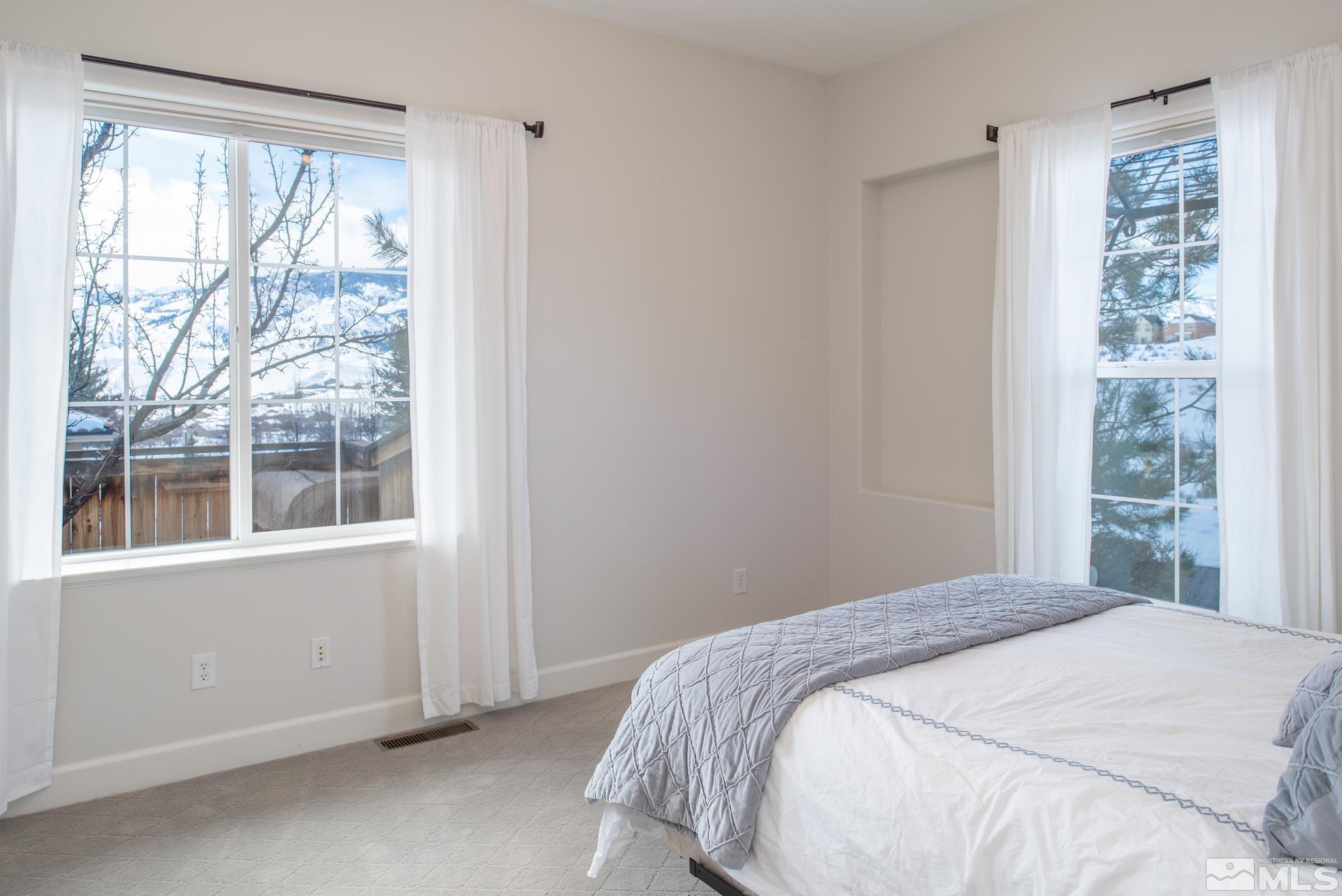 1772 Fairway Hills Trail Reno, NV 89523 - Photo 22 of 33 a bedroom with a bed and a window