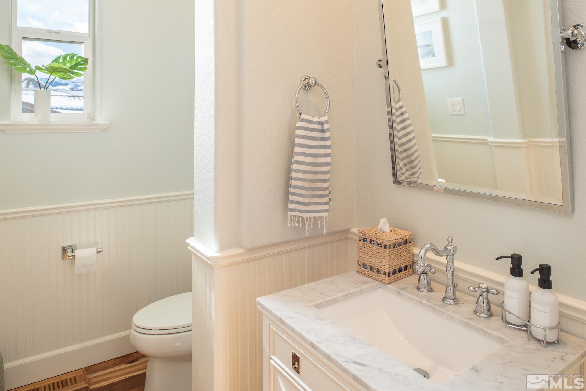 1772 Fairway Hills Trail Reno, NV 89523 - Photo 24 of 33 a bathroom with a sink a toilet and shower curtain