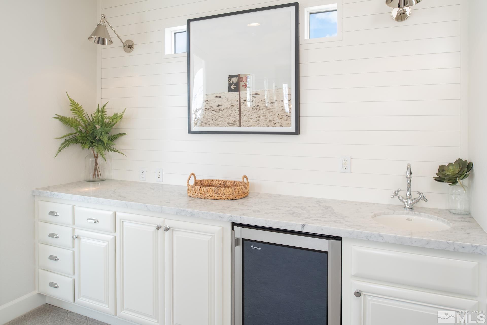 1772 Fairway Hills Trail Reno, NV 89523 - Photo 28 of 33 a bathroom with a granite countertop sink and a mirror