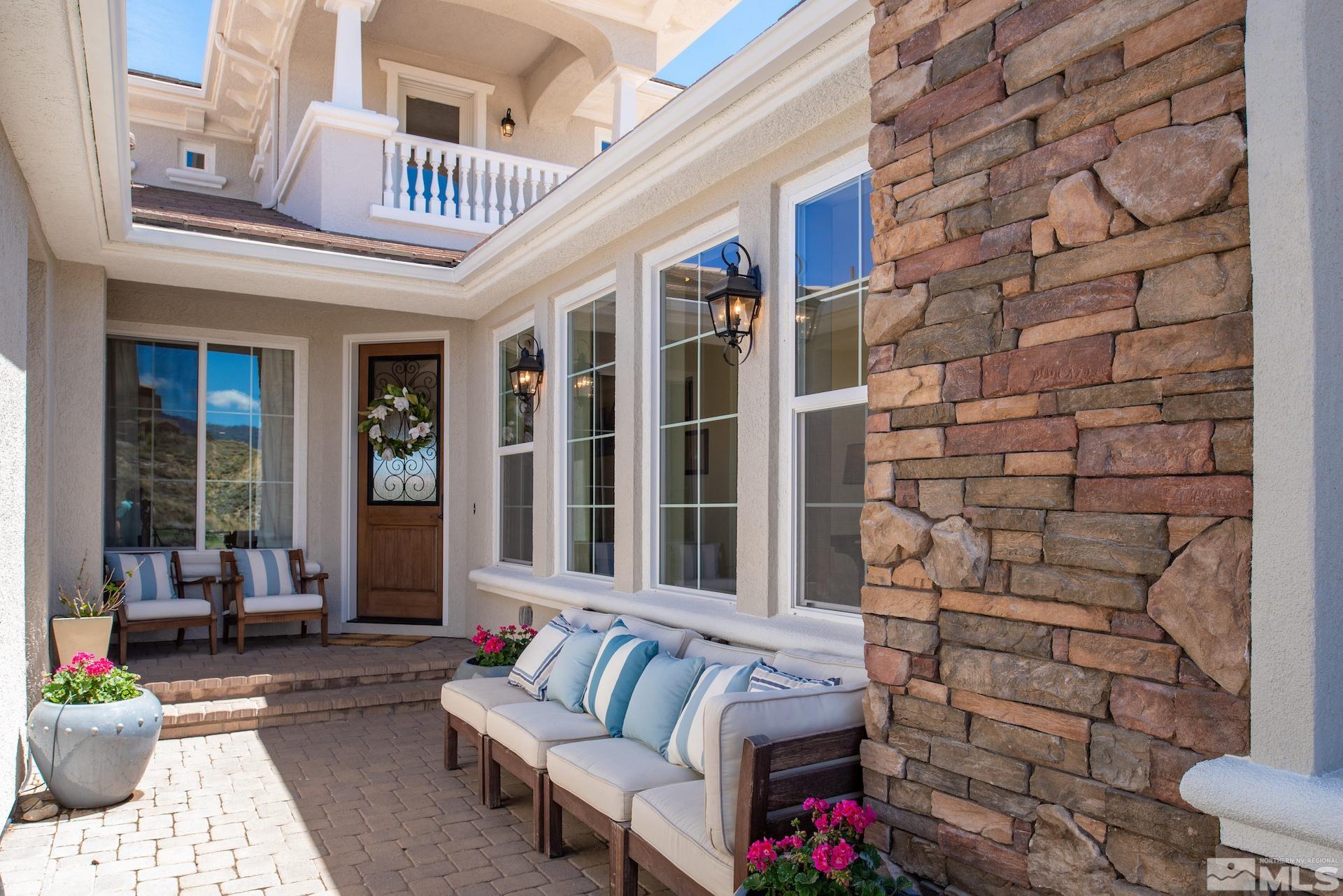 1772 Fairway Hills Trail Reno, NV 89523 - Photo 33 of 33 a view of a patio with couches table and chairs and potted plants