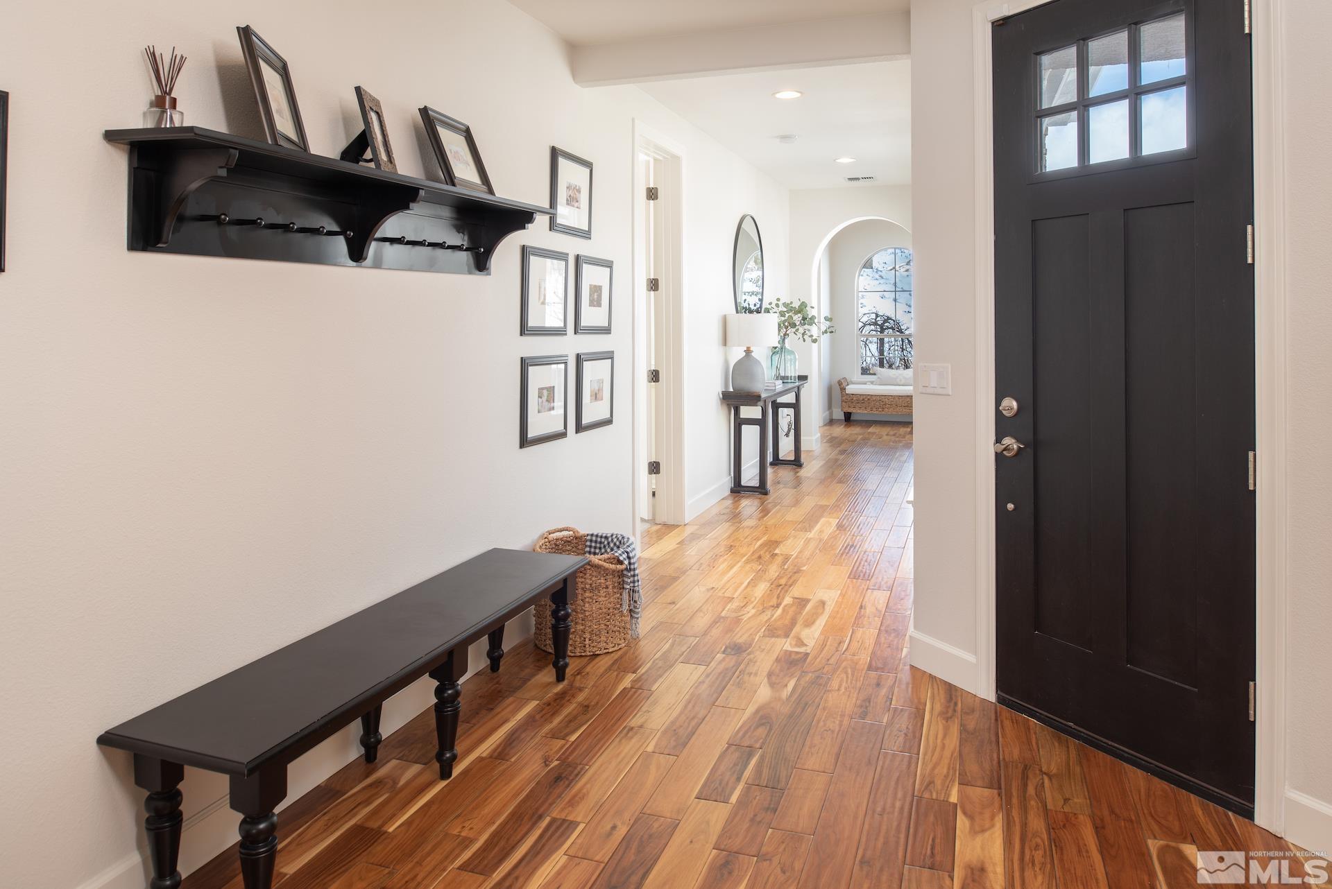 1772 Fairway Hills Trail Reno, NV 89523 - Photo 4 of 33 a view of hallway with wooden floor and stairs