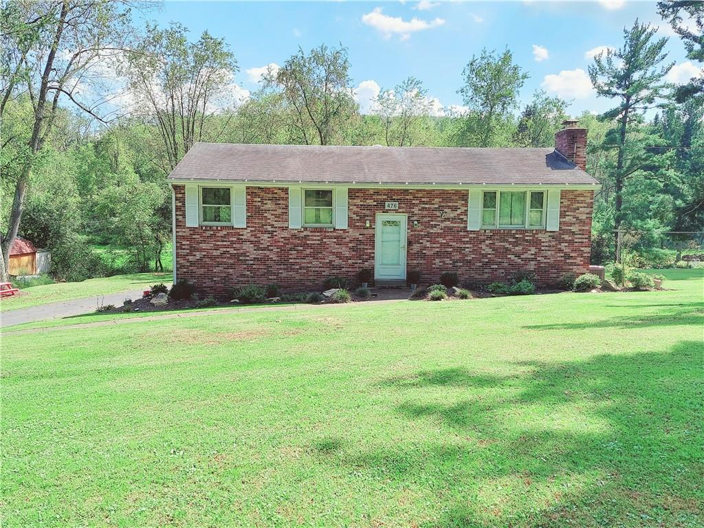 476 Ross Road Eighty Four, PA 15330 - Photo 2 of 20 a front view of a house with a garden