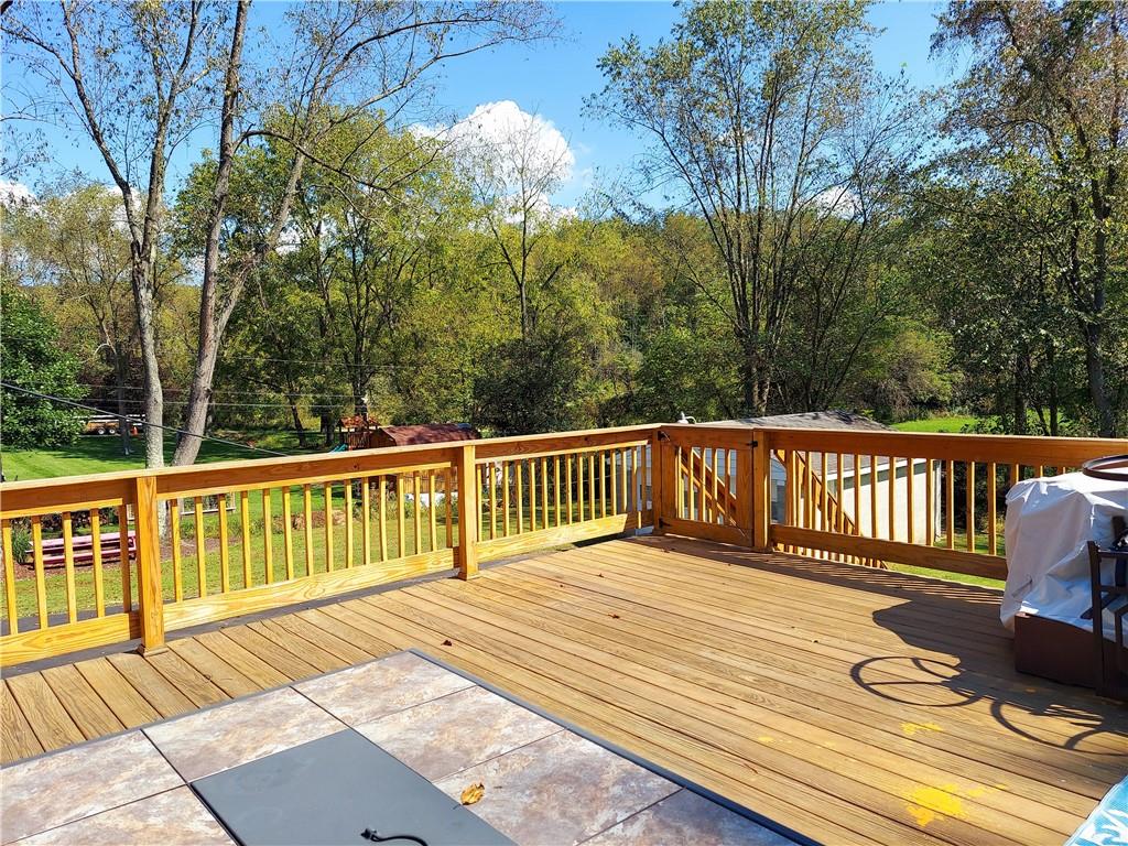 476 Ross Road Eighty Four, PA 15330 - Photo 12 of 20 a balcony with wooden floor and fence