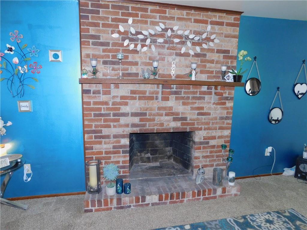 476 Ross Road Eighty Four, PA 15330 - Photo 15 of 20 a room with a fireplace and a potted plant