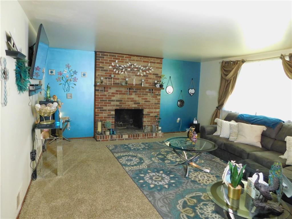 476 Ross Road Eighty Four, PA 15330 - Photo 17 of 20 a living room with furniture and a fireplace