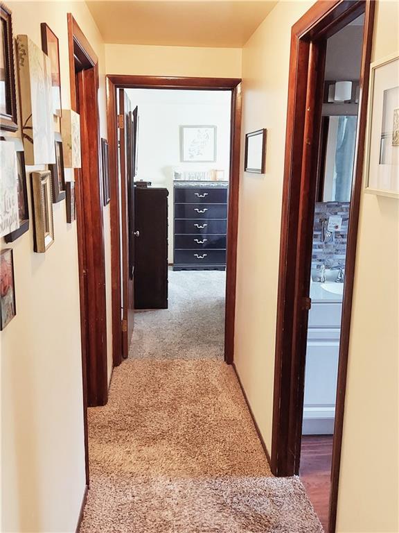476 Ross Road Eighty Four, PA 15330 - Photo 20 of 20 a view of a hallway with wooden cabinets and stairs