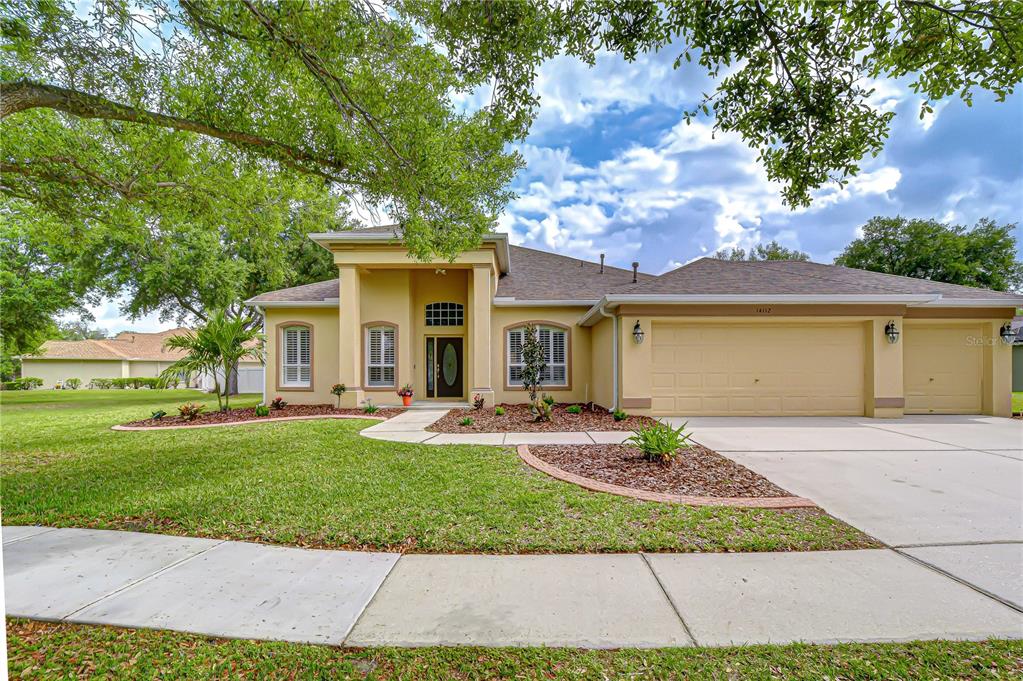 14112 Creek Run Drive Riverview, FL 33579 - Photo 1 of 40 a view of a house with a yard and sitting area