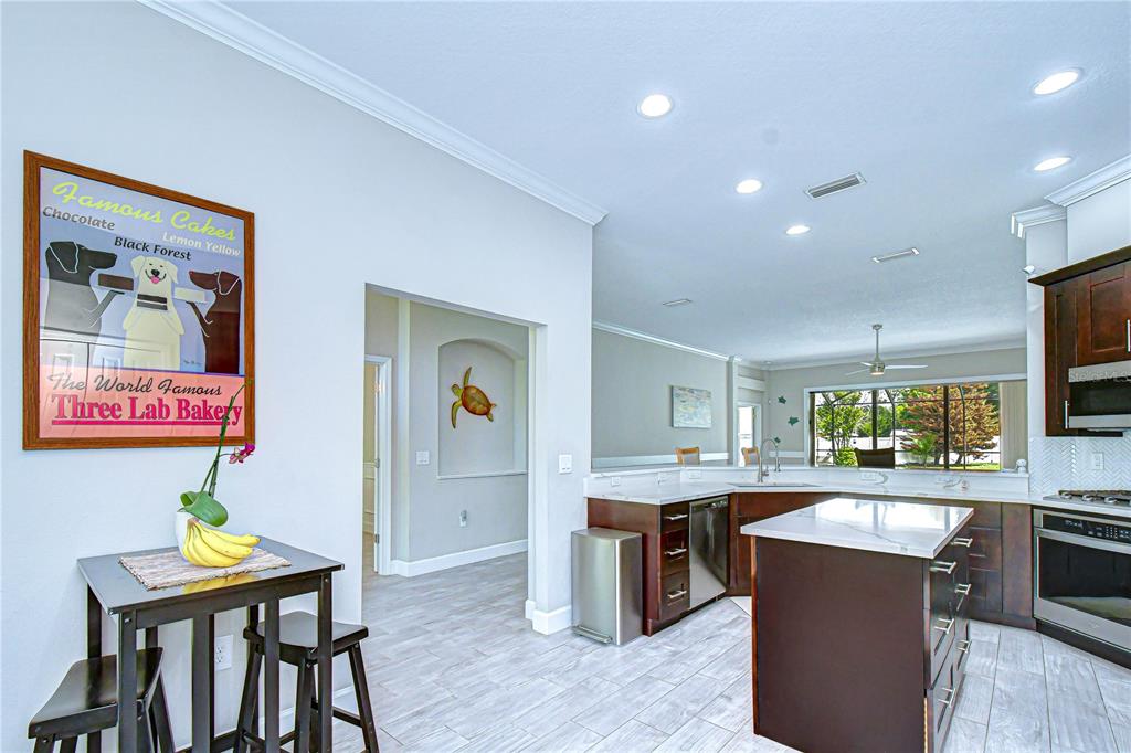 14112 Creek Run Drive Riverview, FL 33579 - Photo 12 of 40 a kitchen with a table and chairs in it