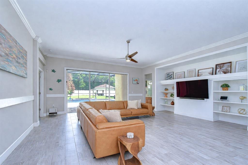 14112 Creek Run Drive Riverview, FL 33579 - Photo 16 of 40 a living room with furniture and a flat screen tv