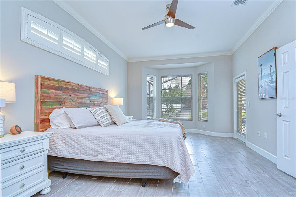 14112 Creek Run Drive Riverview, FL 33579 - Photo 19 of 40 a bedroom with a large bed and a large window