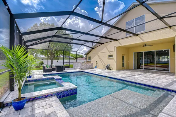 a view of a backyard with sitting area