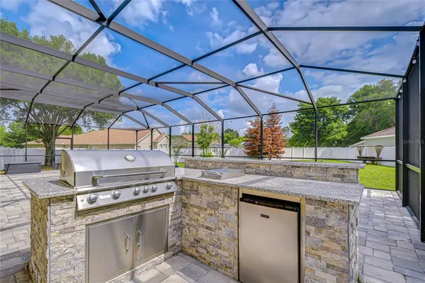 a view of kitchen with a sink and stove