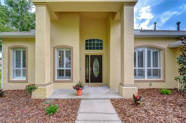 a front view of a house with a porch