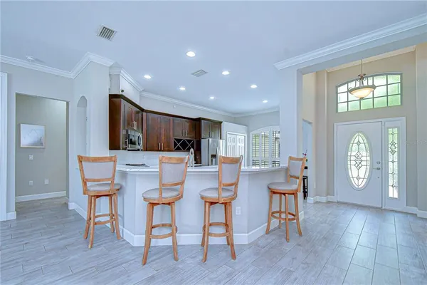 a view of a dining room with furniture and wooden floor