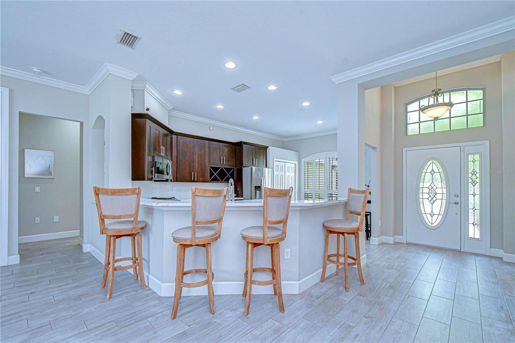 14112 Creek Run Drive Riverview, FL 33579 - Photo 10 of 40 a view of a dining room with furniture and wooden floor