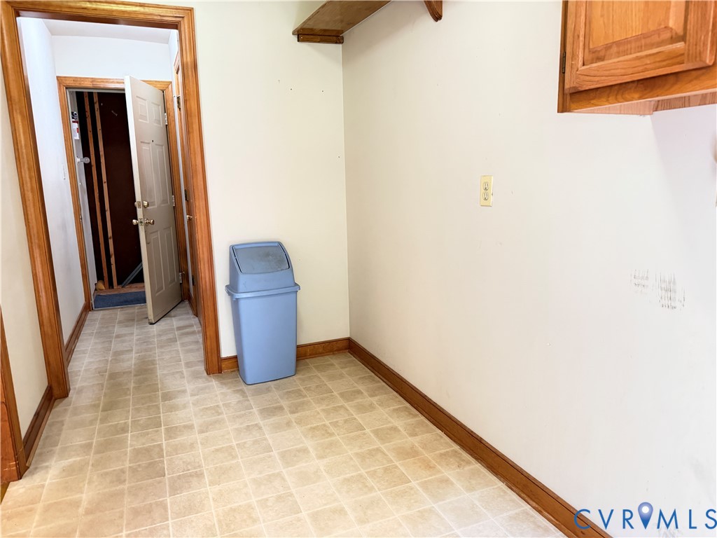 3933 Dunraven Road North Chesterfield, VA 23236 - Photo 20 of 30 a view of hallway with a chair and a potted plant