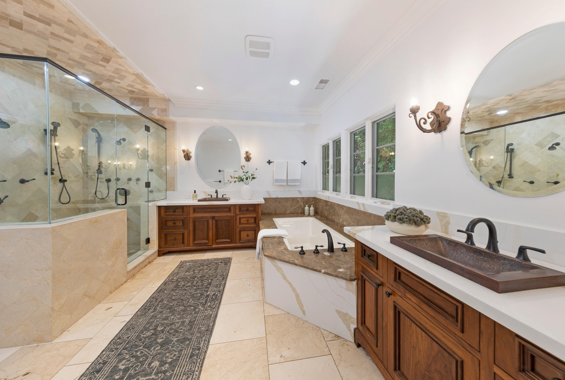 1493 Sycamore Canyon Road Montecito, CA 93108 - Photo 18 of 47 a large bathroom with a double vanity sink double mirror and bathtub