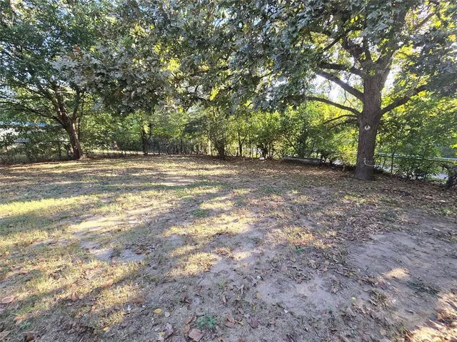 a view of a yard with a trees
