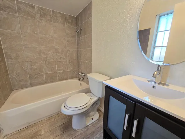 a bathroom with a sink toilet and a bathtub