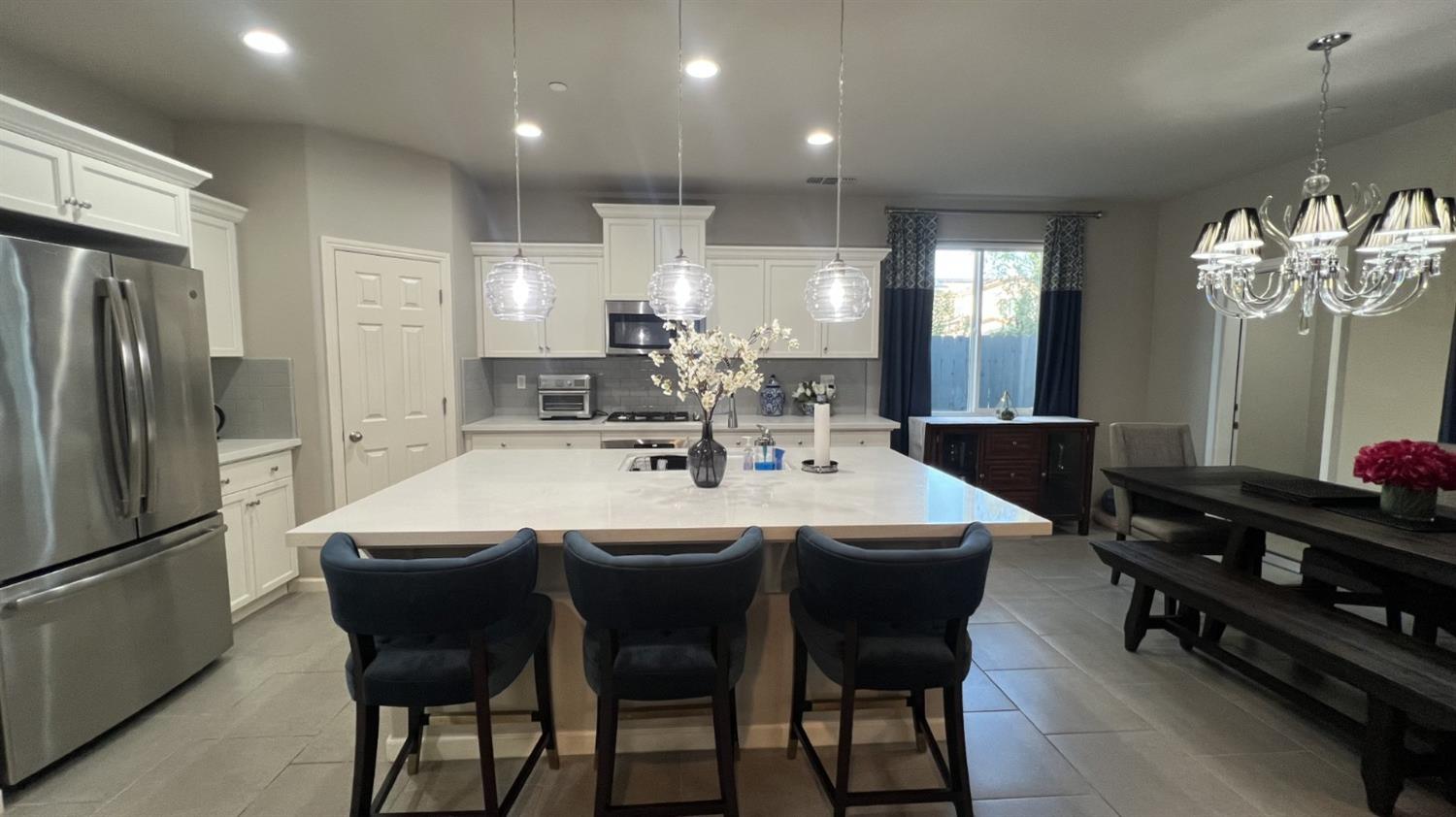 3525 Cordova Avenue Clovis, CA 93619 - Photo 10 of 35 a large kitchen with a table and chairs