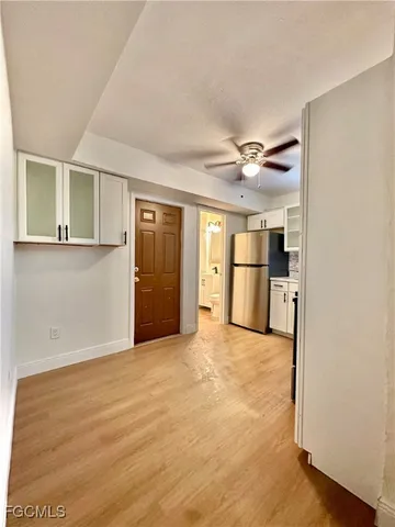 a view of a kitchen with a sink and a window