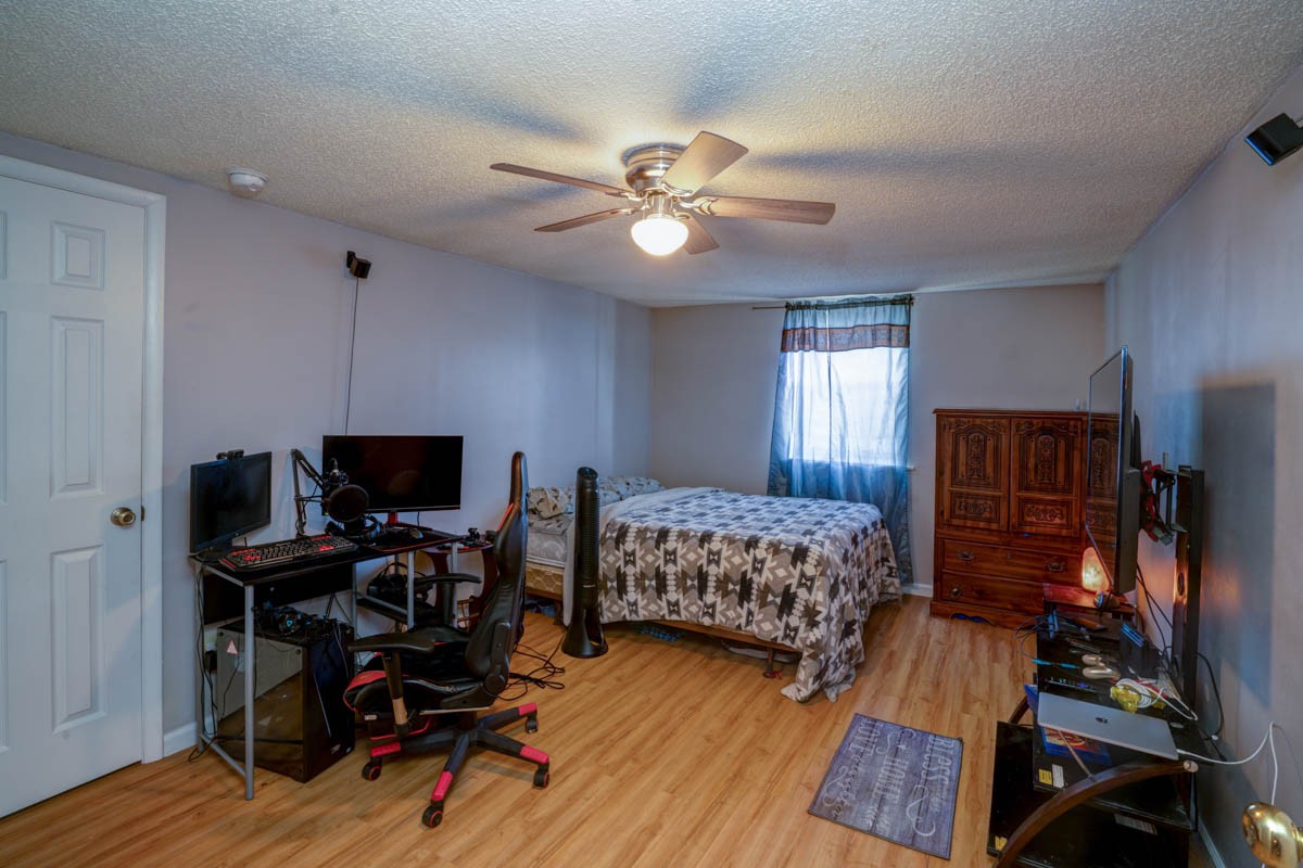 1157 Morgan Road Lafayette, TN 37083 - Photo 28 of 45 a bedroom with bed and a chandelier