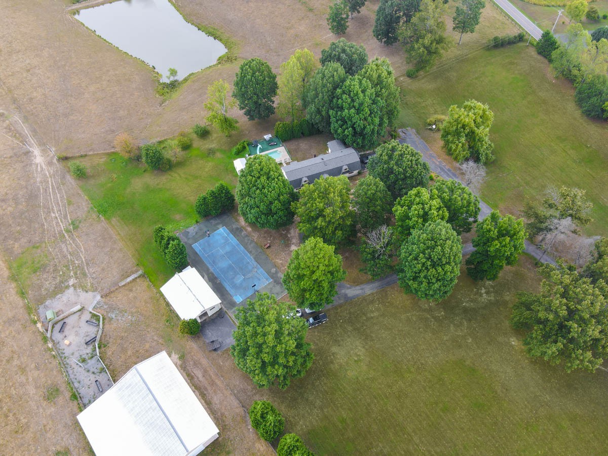 1157 Morgan Road Lafayette, TN 37083 - Photo 42 of 45 an aerial view of a house with a yard and garden