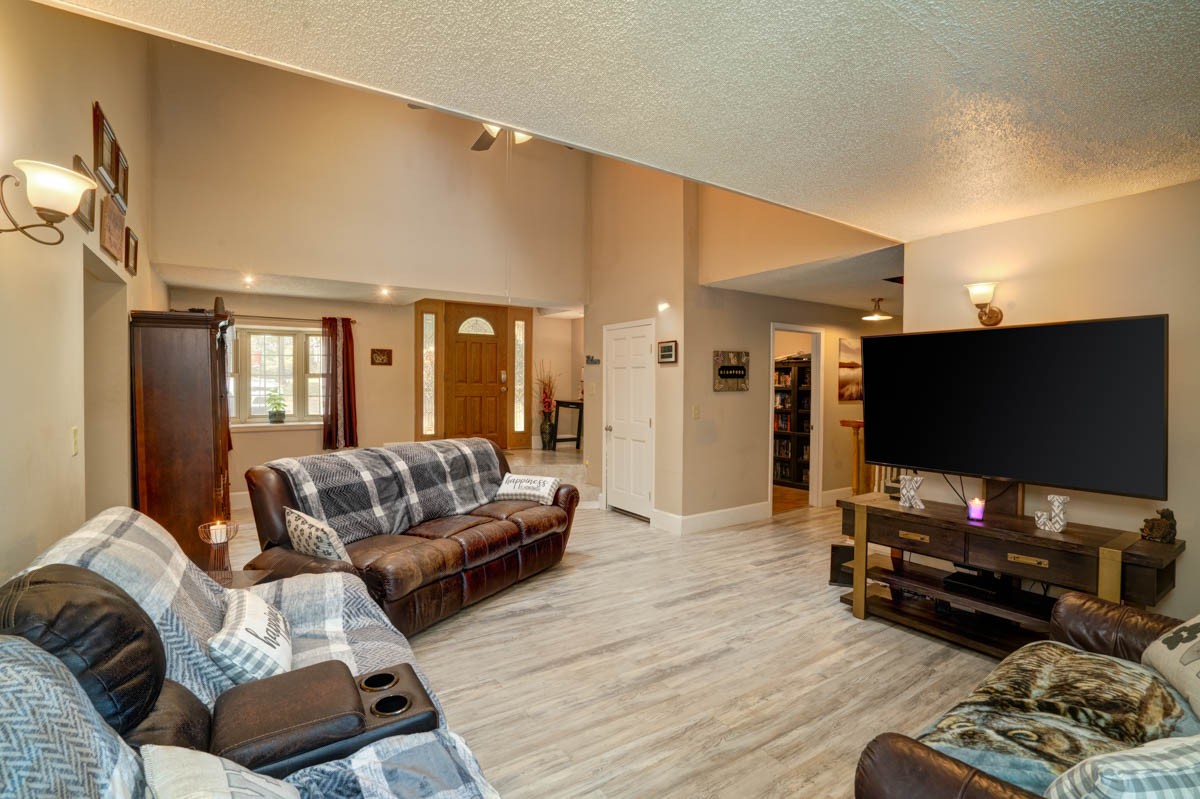 1157 Morgan Road Lafayette, TN 37083 - Photo 7 of 45 a living room with furniture and a flat screen tv