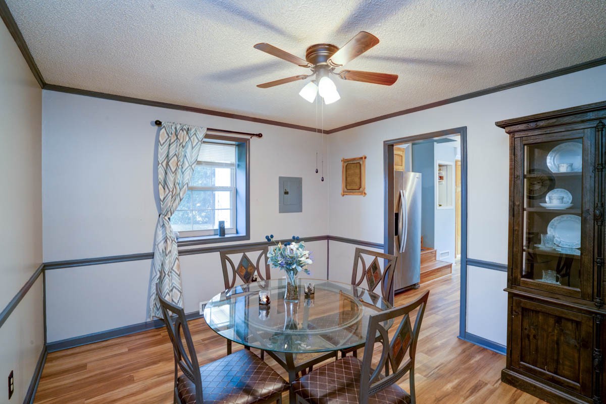 1157 Morgan Road Lafayette, TN 37083 - Photo 10 of 45 a view of a dining room with furniture a chandelier and wooden floor