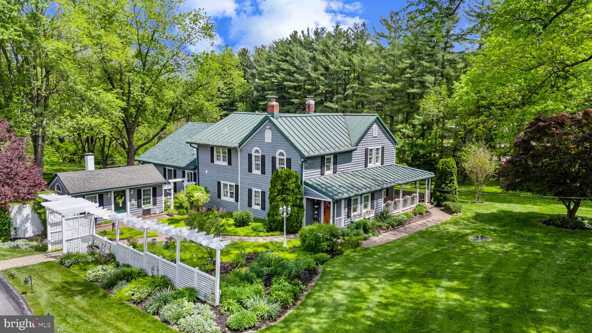 an aerial view of a house with a garden and plants