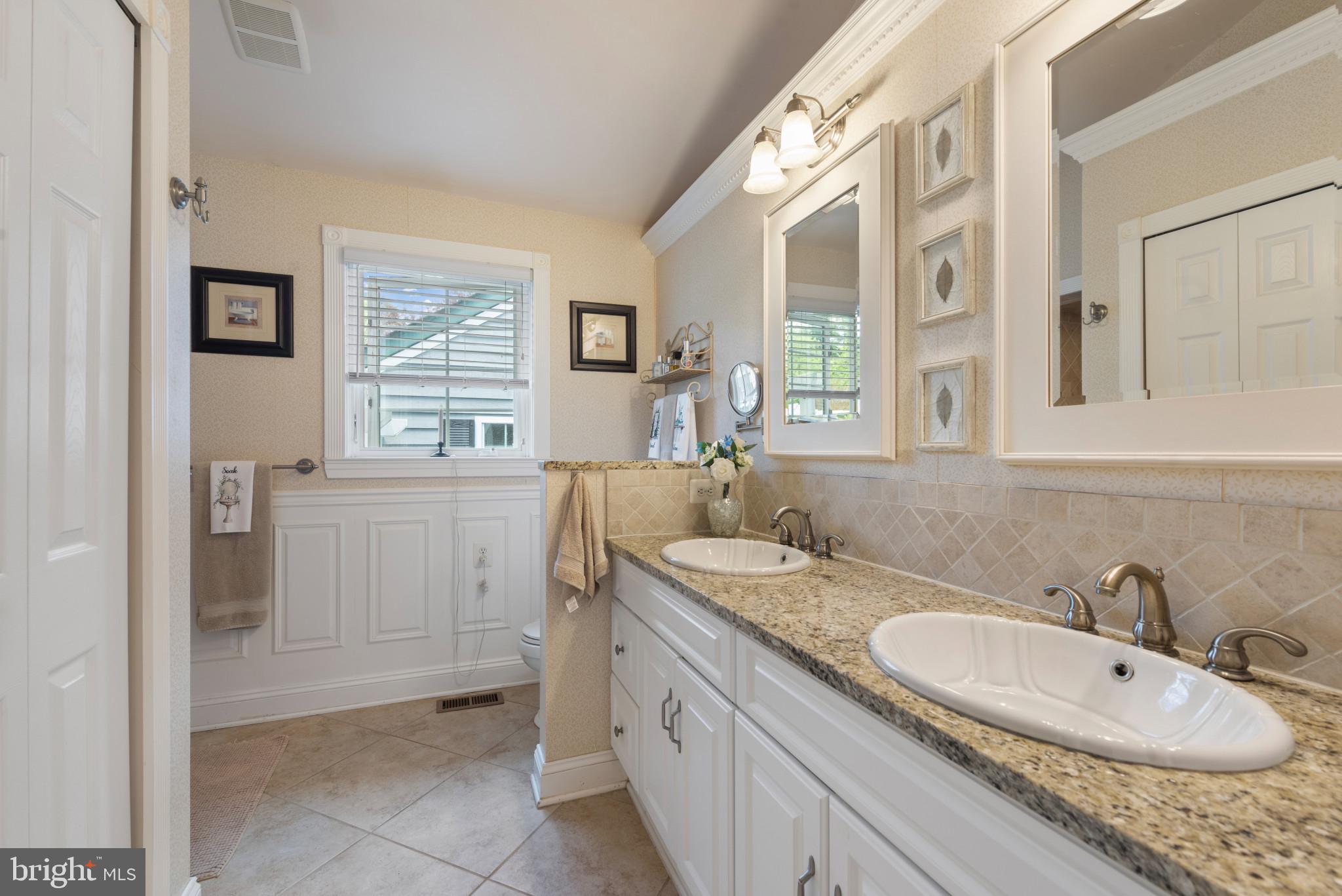 832 Muller Road Westminster, MD 21157 - Photo 11 of 39 a bathroom with a granite countertop sink mirror and a
