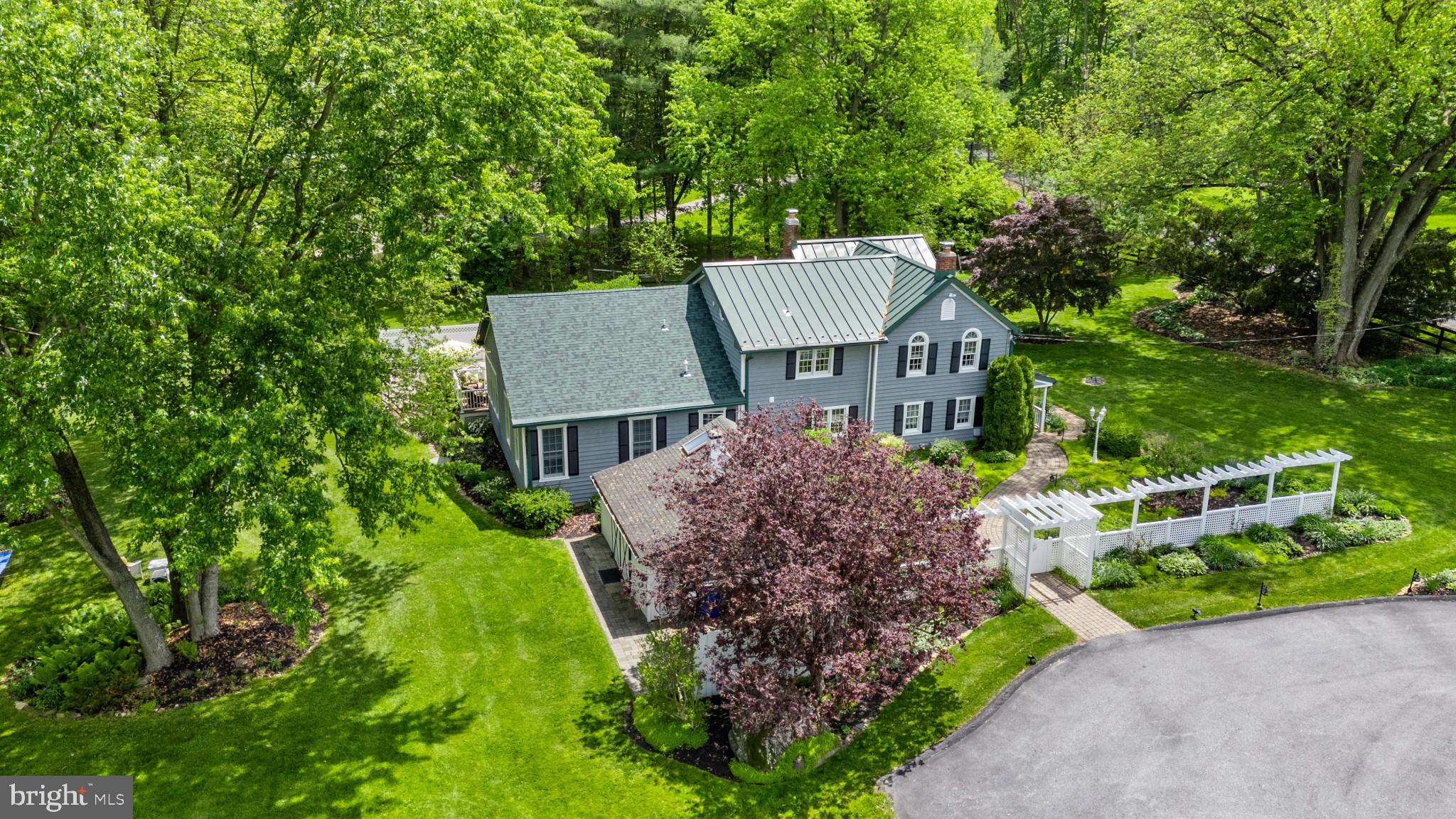 832 Muller Road Westminster, MD 21157 - Photo 37 of 39 a front view of a house with a garden and trees
