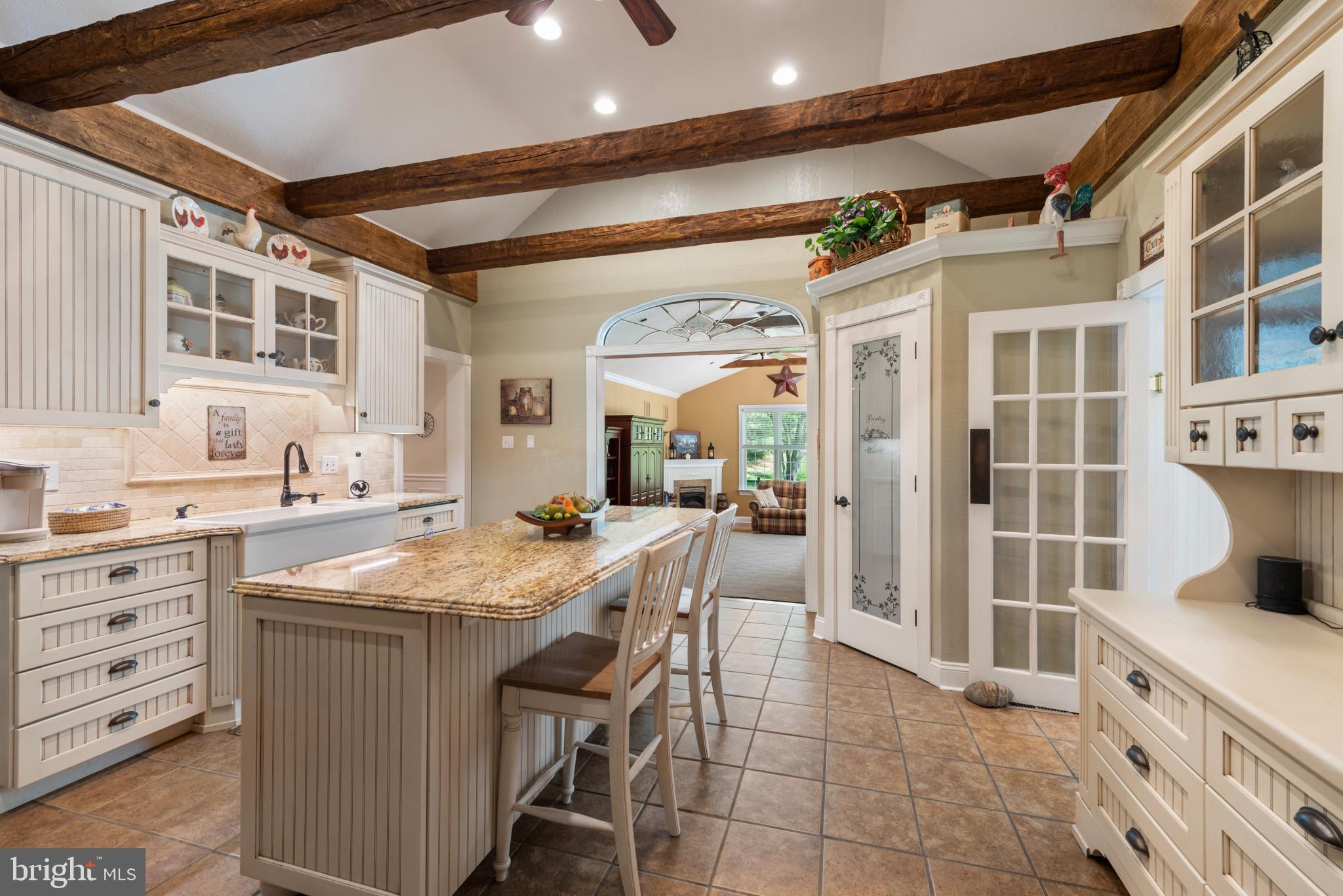 832 Muller Road Westminster, MD 21157 - Photo 6 of 39 a kitchen with a sink stove and cabinets