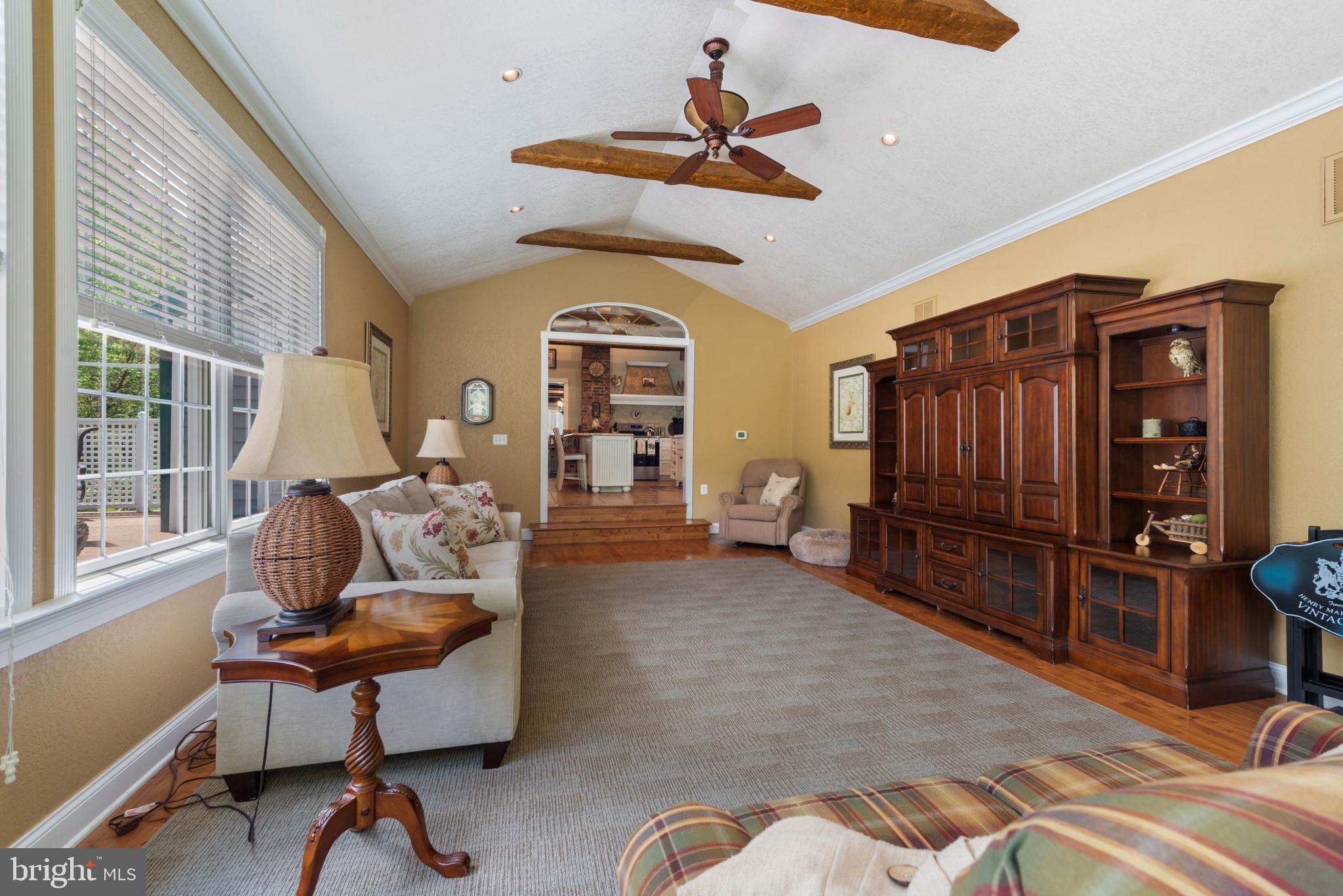 832 Muller Road Westminster, MD 21157 - Photo 9 of 39 a living room with furniture a ceiling fan and a window