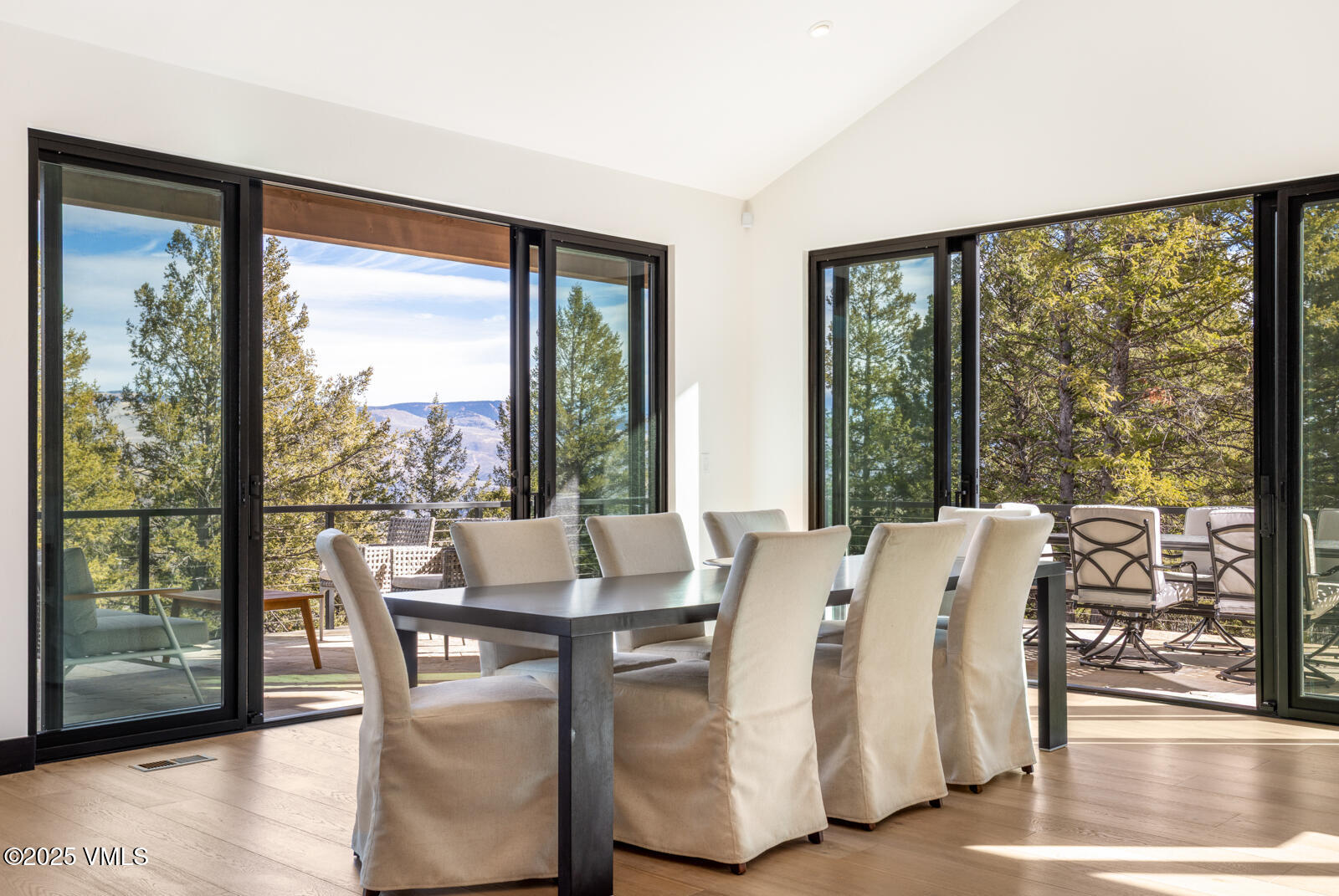 171 Sunquist Road Edwards, CO 81632 - Photo 7 of 101 a view of a dining room with furniture window and wooden floor