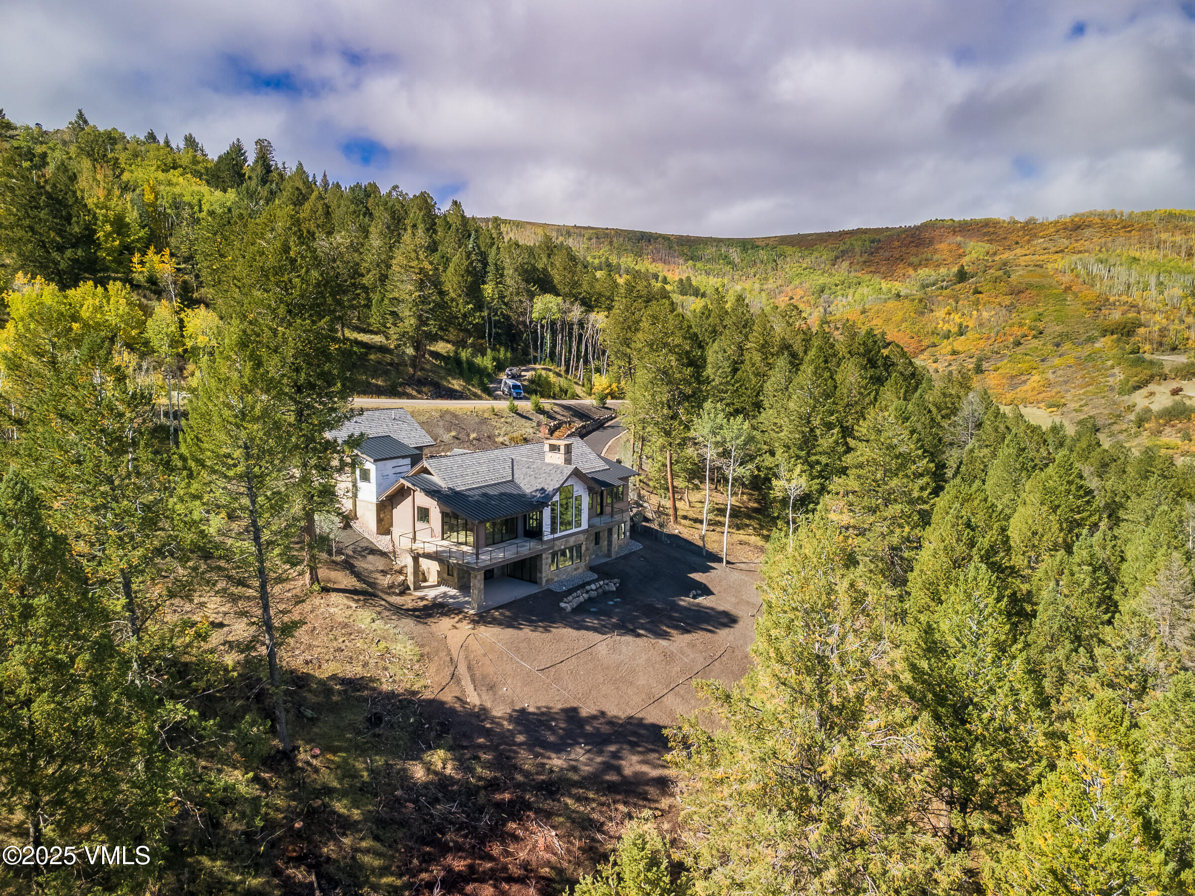 171 Sunquist Road Edwards, CO 81632 - Photo 89 of 101 a view of a lake with a building in the background