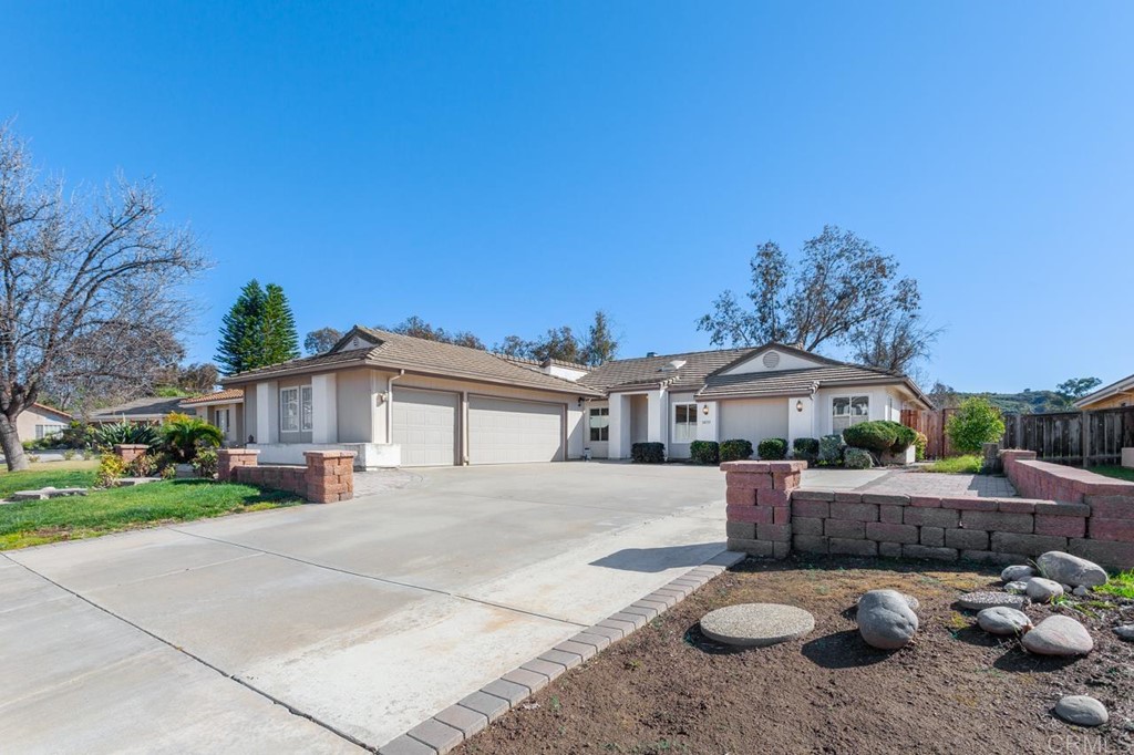14133 Rio Court Poway, CA 92064 - Photo 1 of 1 a front view of a house with cars parked