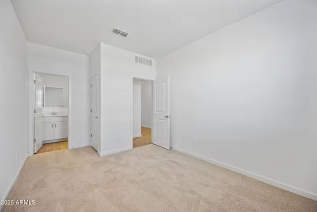 a bathroom with a sink toilet vanity and tub