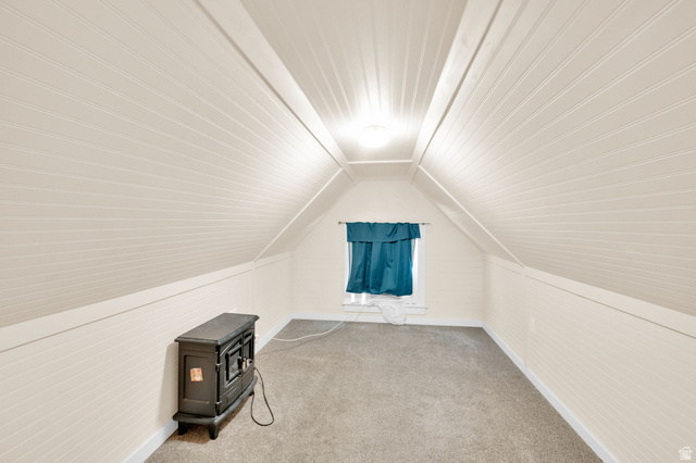501 Canyon Road Ogden, UT 84404 - Photo 15 of 30 Attic space featuring vaulted ceilings with beadboard paneling, neutral carpeting, and a single window