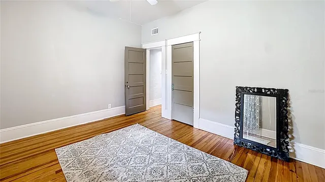 wooden floor in a hall with an entryway