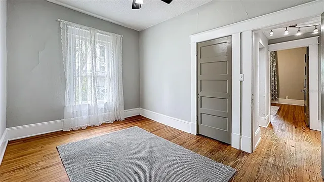 a view of livingroom with hardwood floor and a ceiling fan