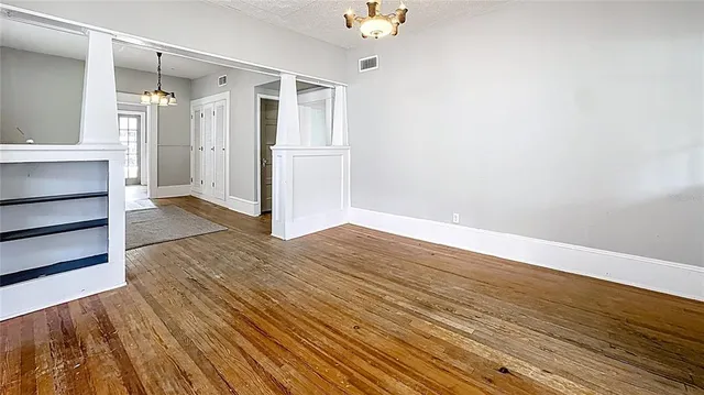a view of hallway with wooden floor