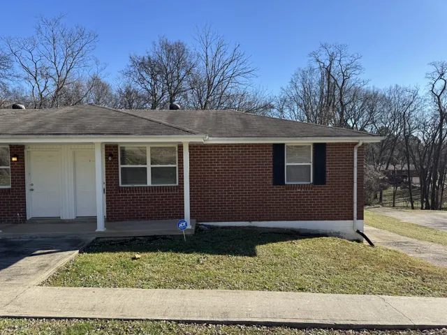 a house with trees in front of it