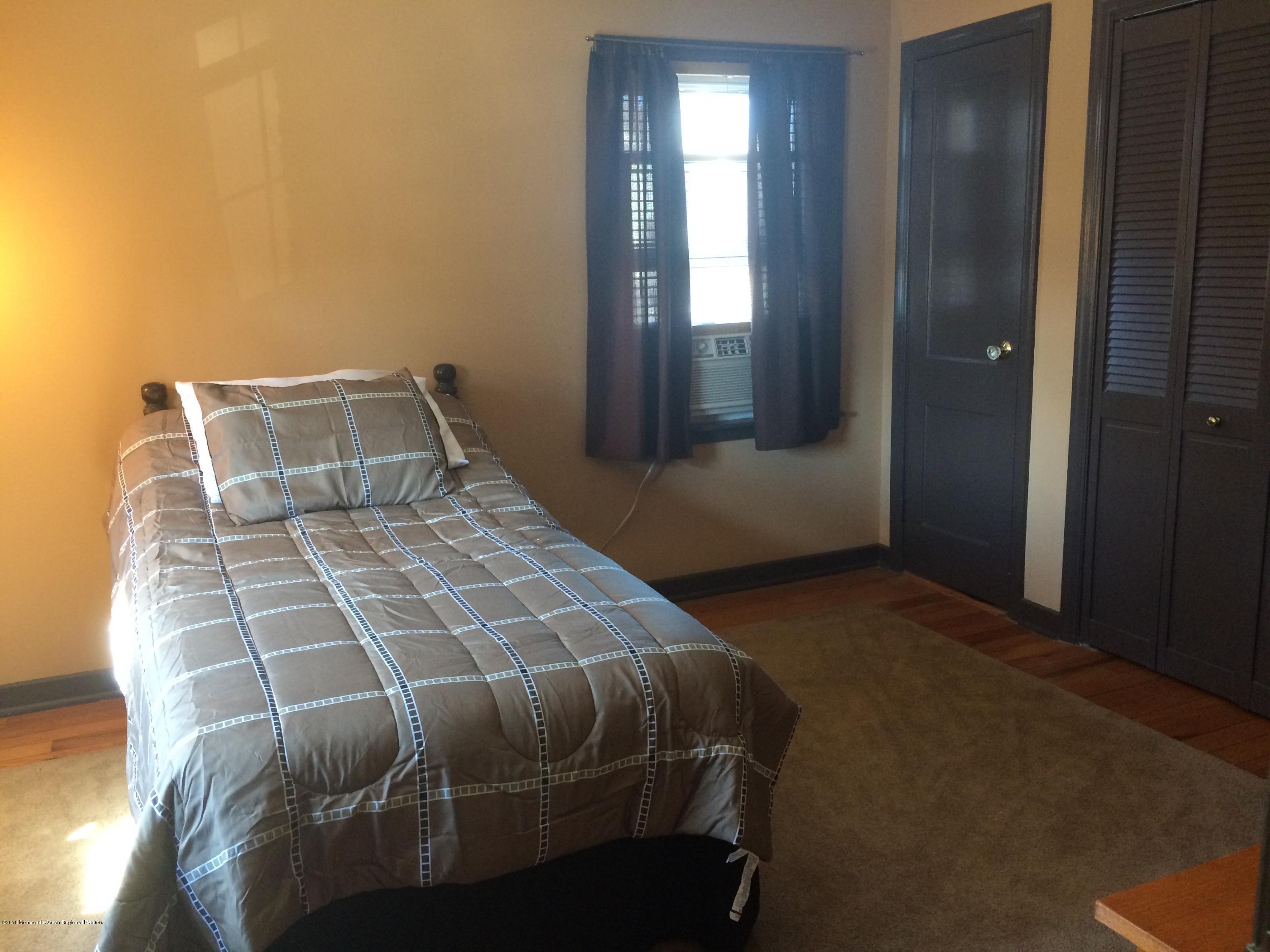 22 Pinckney Road, Unit C Red Bank, NJ 07701 - Photo 11 of 13 a bedroom with a bed and window